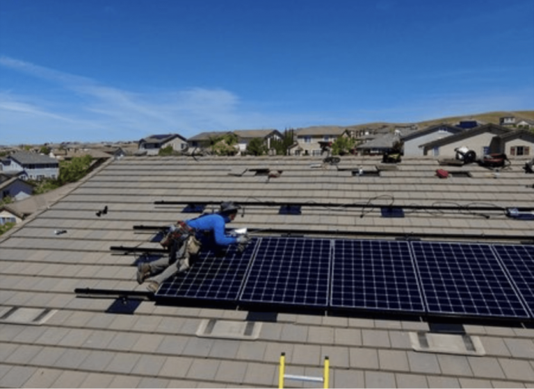 Solar Bill Review installer working on rooftop solar panel installation — local skilled professionals